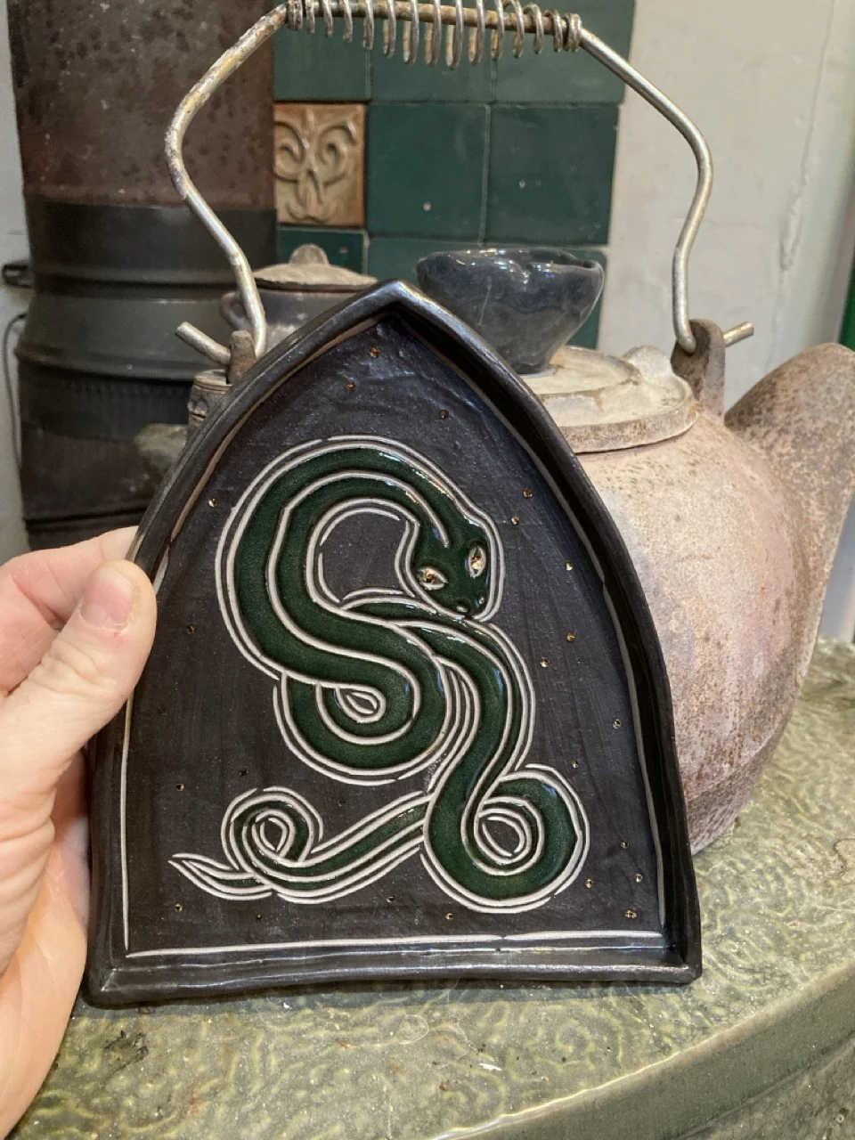 Triangular platter with dark green snake